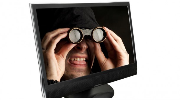 Computer monitor with a view of a person with binoculars 