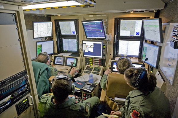 4-person military team in a Predator cockpit