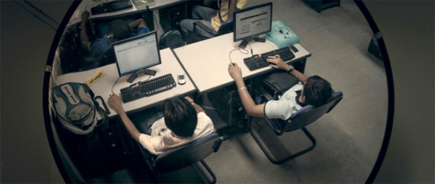 Two students sitting at computer stations