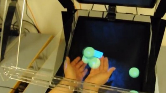 Two hands underneath hologram objects