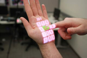 Image of a telephone pad projected on a hand