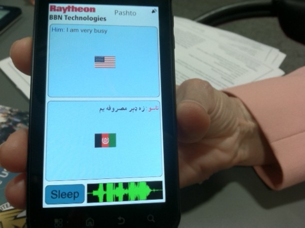 Smartphone on display showing a top-to-bottom split screen translating from one language to another